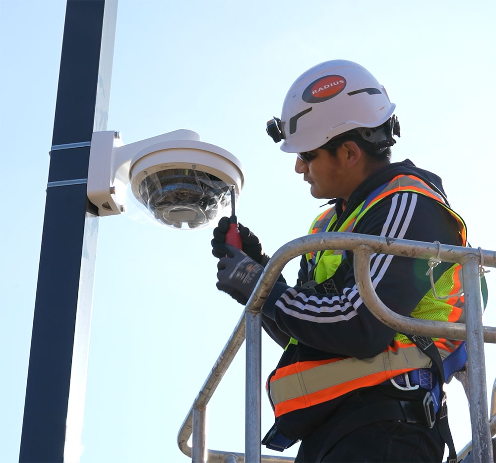 Security technician installing a camera