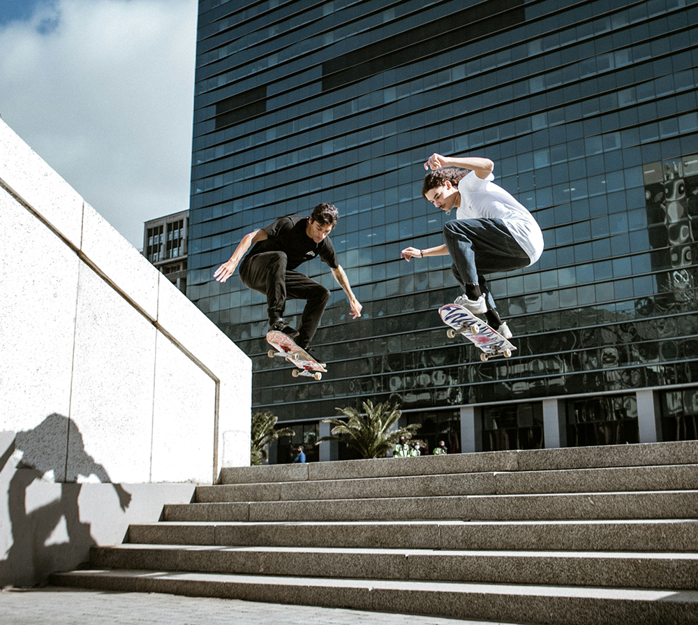 skateboarders on steps of building