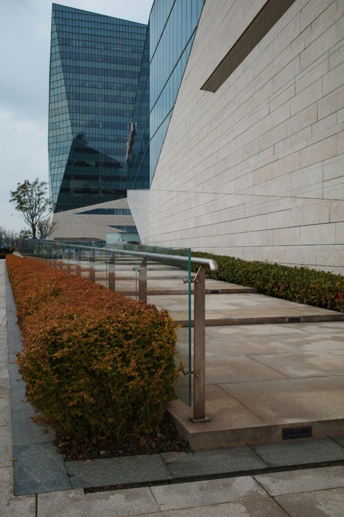 Pedestrian ramp with manicured landscaping Pedestrian ramp with manicured landscaping