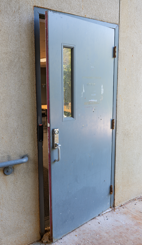 emergency door propped open by rock emergency door propped open by rock